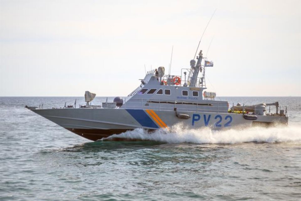 cover Warning shots fired after migrant boat attempts to ram police vessel
